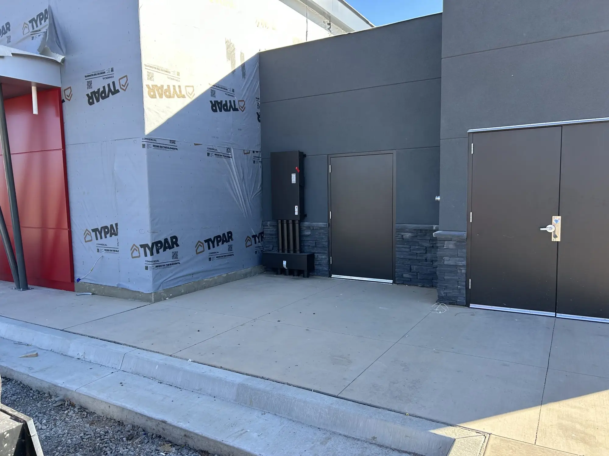 The rear elevation of a commercial building nearing completion